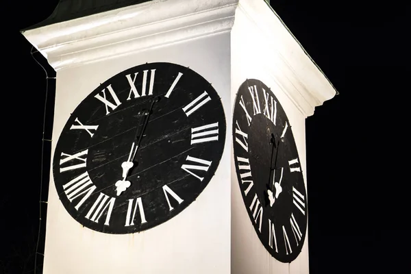 Old clock tower in Novi Sad, Serbia at night