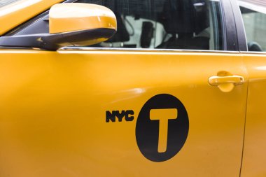 NEW YORK, USA - AUGUST 31, 2017: Taxi cab on the street of New York City. There is 13,237 taxi cabs operating in New York City which have 241 million annual taxi passengers. clipart