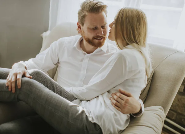 Young Loving Couple Sofa Sitting Hugging Sofa — Stock Photo, Image