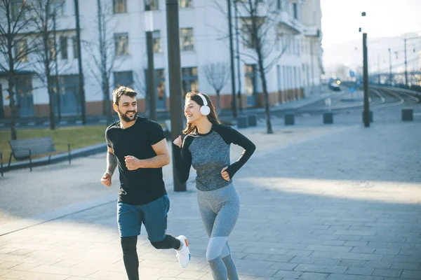 Young couple running  in the morning as a good habit
