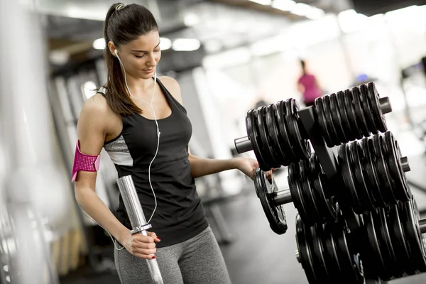 Young woman in the gym preparing for training