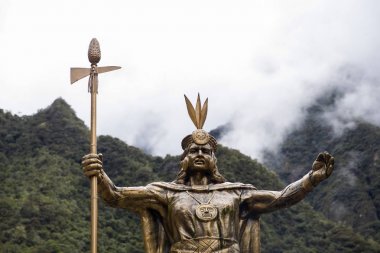 AGUAS CALIENTES, PERU - JANUARY 3, 2018: Statue of Pachacuti in Aguas Calientes, Peru. Pachacuti was the 9th Sapa Inca of the Kingdom of Cusco. clipart