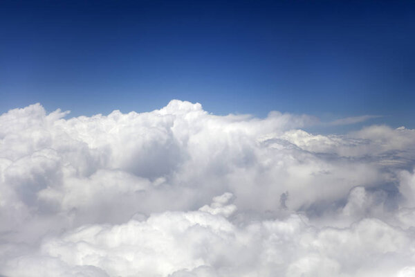 View at the white clouds from airplane