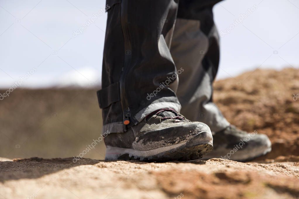 Closeup of the hiker shoes on the mountain