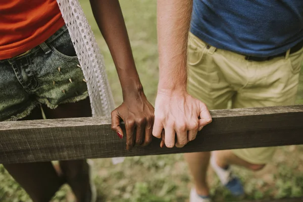 Hands Young Multiracial Couple Wooden Fence Park — Stock Photo, Image