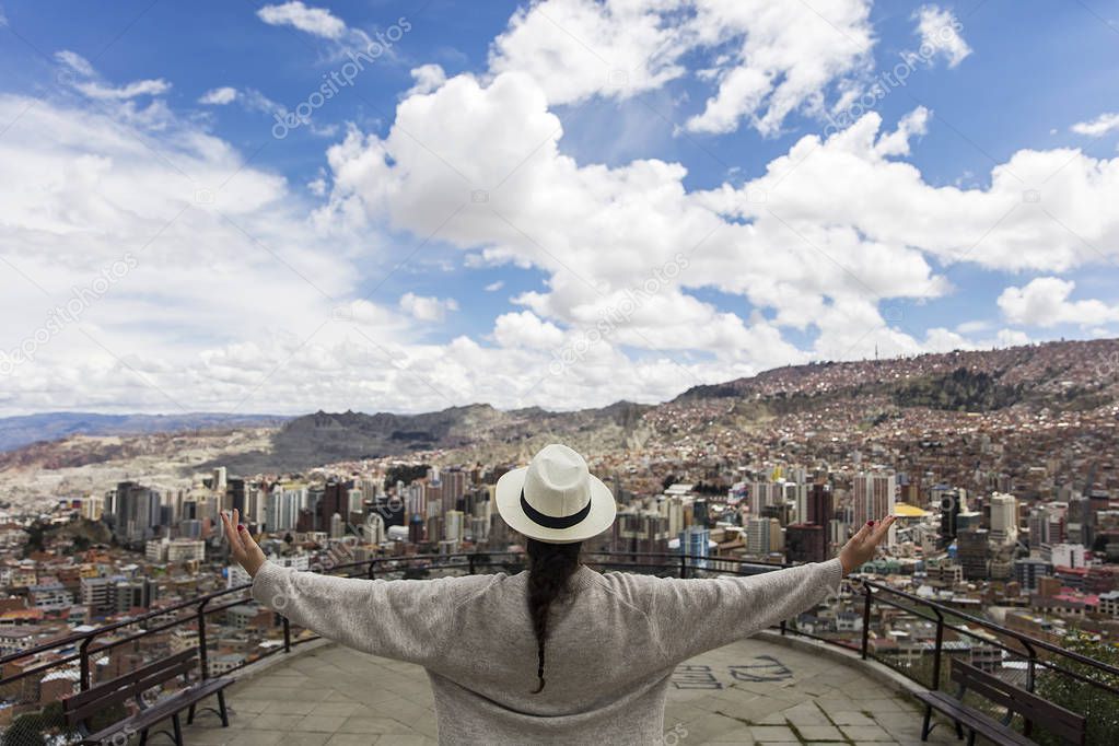 Young woman looking at the panorama of La Paz, Bolivia