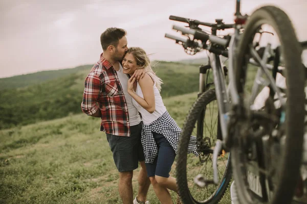 Loving Couple Stnding Next Car Bicycle Nature — стоковое фото