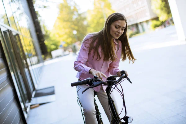 Pretty Young Woman Riding Electric Bicycle Urban Environment — Zdjęcie stockowe