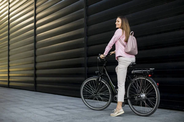 Pretty Young Woman Riding Electric Bicycle Urban Environment — Zdjęcie stockowe