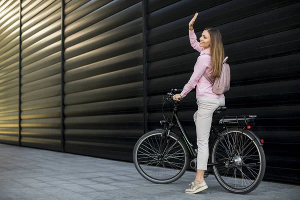 Pretty Young Woman Riding Electric Bicycle Urban Environment — Zdjęcie stockowe