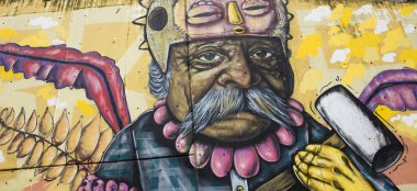 MEDELLIN, COLOMBIA - SEPTEMBER 12, 2019: Street art of Comuna 13 in Medellin, Colombia. Once known as Colombias most dangerous barrio, today graffiti tour is one of the most popular tourist attractions in Medellin. clipart