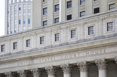 NEW YORK, USA - AUGUST 24, 2017: Detail from Thurgood Marshall United States Courthouse in New York City. It is a Classical Revival courthouse, built 1932-36. clipart