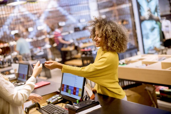 Happy Young Woman Customer Paying Credit Card Fashion Showroom — 图库照片