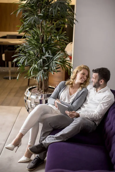 Young Couple Digital Tablet Sitting Sofa — Stockfoto