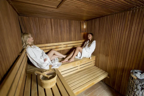 Two Pretty Young Women Relaxing Wooden Sauna — Stock Photo, Image