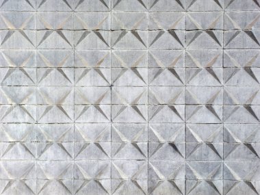 Concrete wall with geometric pattern backdrop