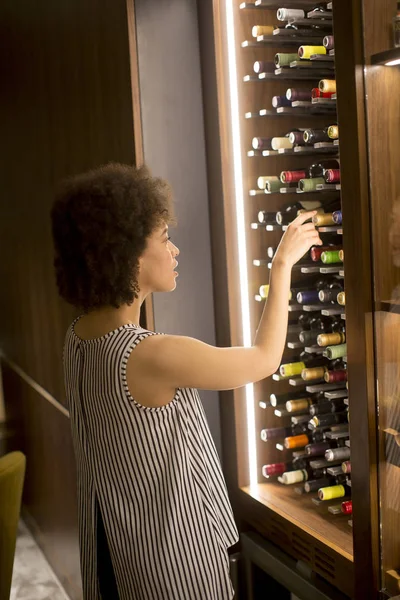 African American Young Woman Choosing Bottle Red Wine — 图库照片