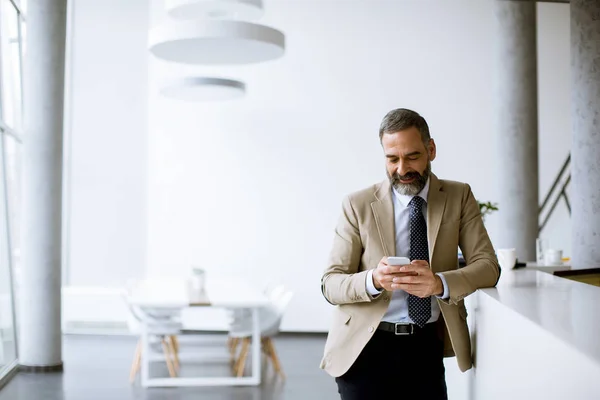 Handsome Senior Businessman Using Mobile Phone Modern Office — 스톡 사진