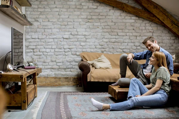 Smiling Lovely Young Couple Relaxing Watching Rustic Home — 스톡 사진