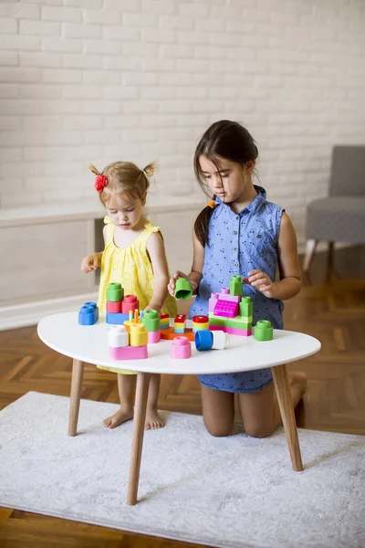 Two Cute Little Girls Play Blocks Table Room — Stock Photo, Image