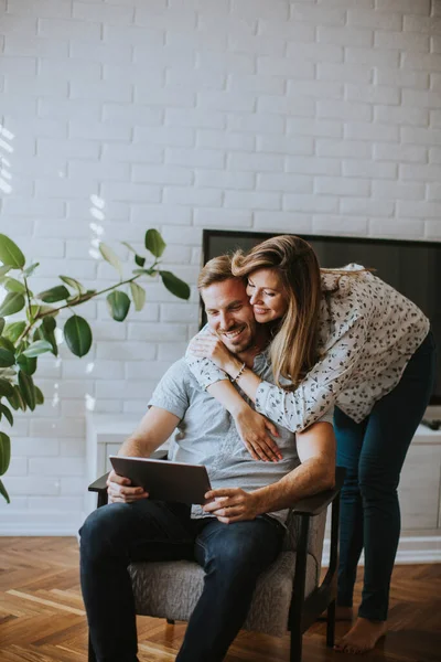 Happy Young Couple Looking Digital Tablet Living Room — Stock Photo, Image