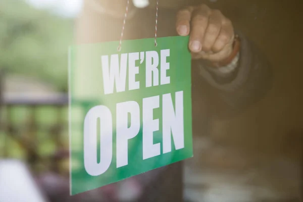 Closeup Business Owner Hanging Open Sign Glass Door — Stock Photo, Image