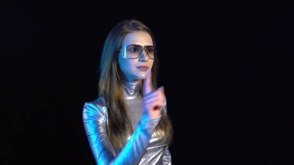 Cyber young woman in silver clothing pressing virtual button — Stock Video