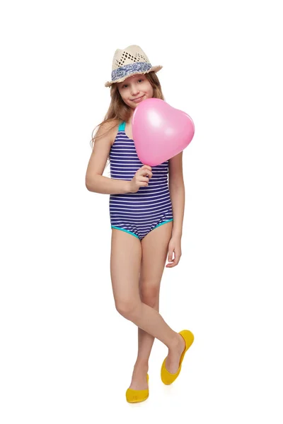 Mädchen in Badeanzug mit rosa Luftballon — Stockfoto