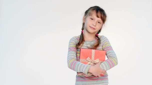 Little girl embracing red gift box — Stock Video