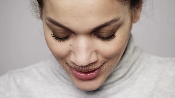 Closeup of young mixed race woman looking at camera smiling — Stock Video