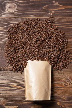 Mock-up craft paper pouch bags with coffee beans over clipart