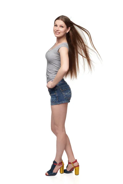 Beautiful full length female in shorts and top with long hair — Stock Photo, Image