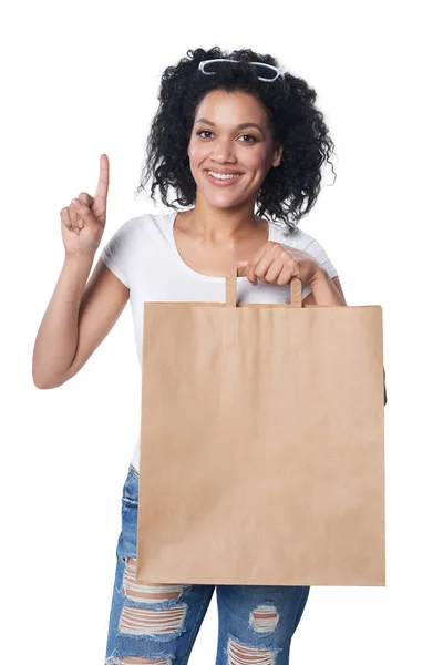 Γυναίκα με δάχτυλο, τσάντα για ψώνια μέχρι — Φωτογραφία Αρχείου