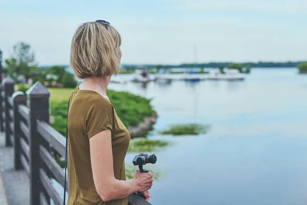 Woman capturing herself with personal camera — Stock Photo, Image