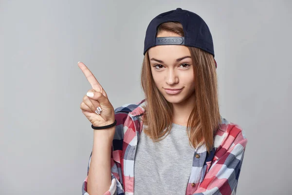 Teen girl pointing at empty copy space — Stock Photo, Image