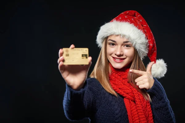 Girl in Santa hat with blank credit card — Stock Photo, Image