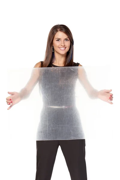 Woman holding transparent sheet of plastic — Stock Photo, Image