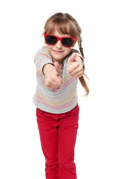 Child girl in sunglasses gesturing thumb up — Stock Photo, Image