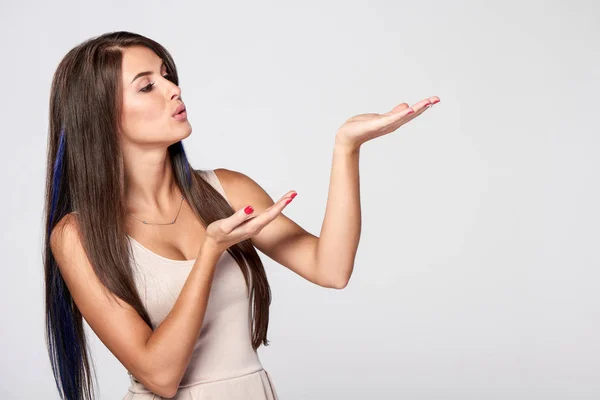 Woman blowing on palm — Stock Photo, Image