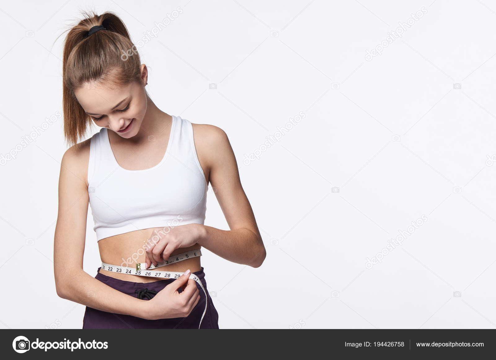 girl measuring her waist measuring tape, Stock image