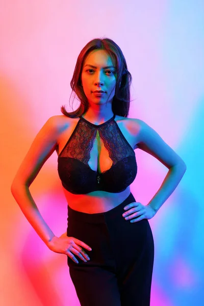 Beauty fashion portrait of female in black lingerie with colorful neon light — 스톡 사진