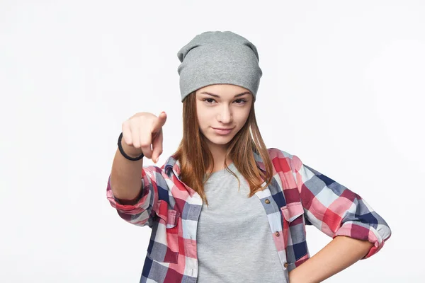Focused teen girl looking and pointing finger at camera — Stock Photo, Image