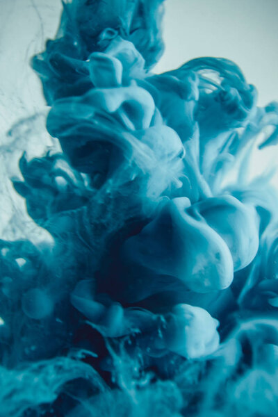 The blue dye in the water. Abstract background. Wallpaper. Concept art