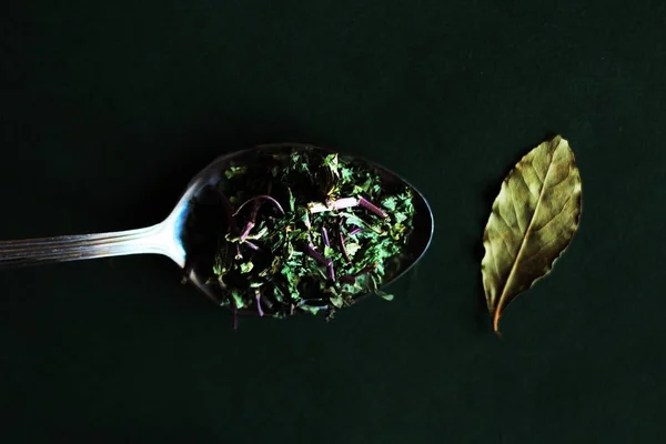 Seasoning food in the spoon. Food photo. kitchen herbs
