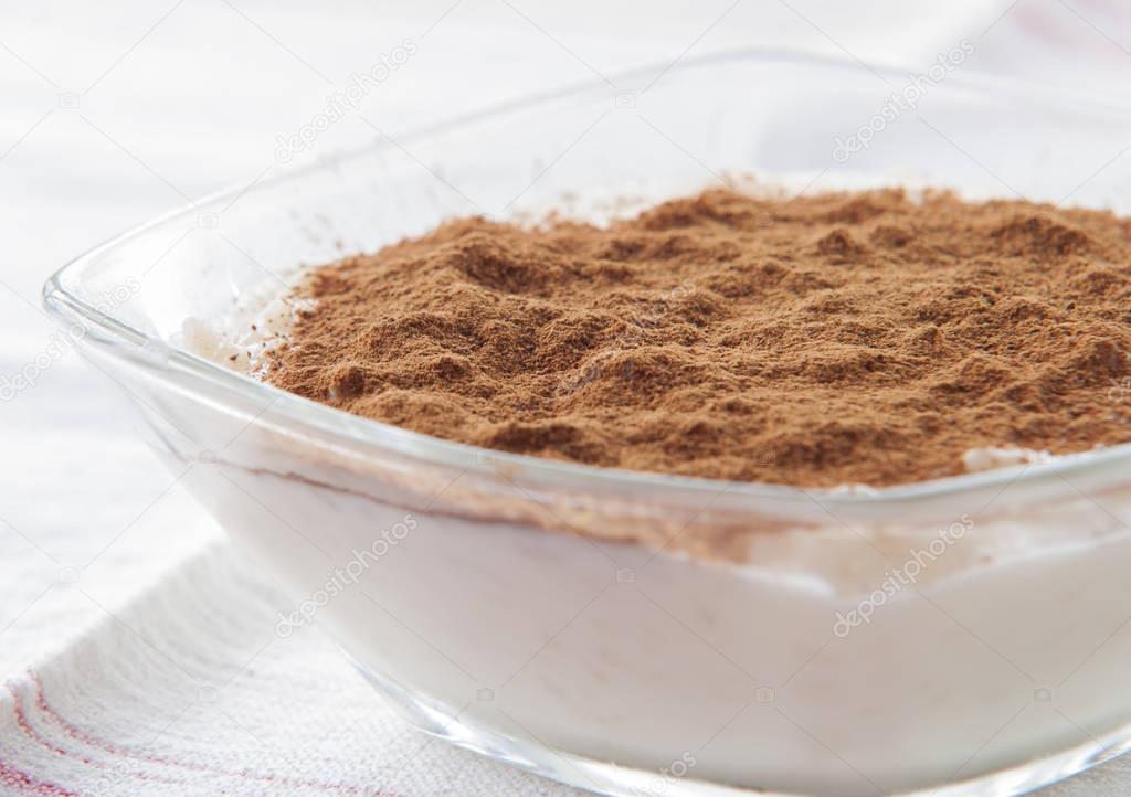 Creamy rice pudding with cinnamon. A simple, nutritious dessert made from rice, milk, eggs, vanilla and sugar.