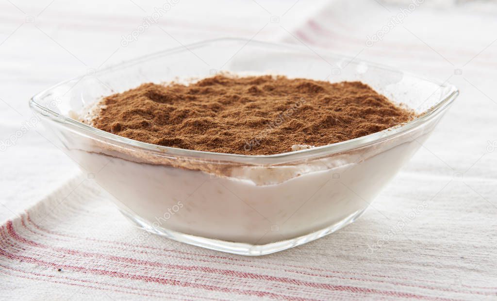 Creamy rice pudding with cinnamon. A simple, nutritious dessert made from rice, milk, eggs, vanilla and sugar.