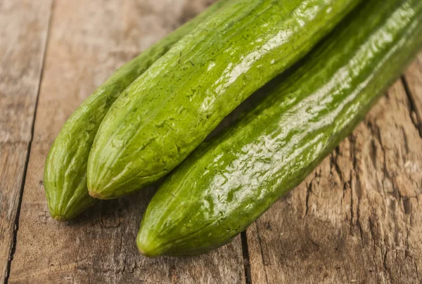 Cucumbers on a wooden background. — Stock Photo, Image