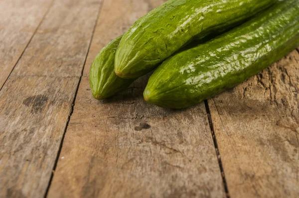 Cucumbers on a wooden background. — Stock Photo, Image