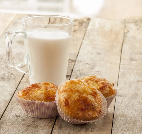 Savory cheese and bacon muffins on the wooden table — Stock Photo, Image