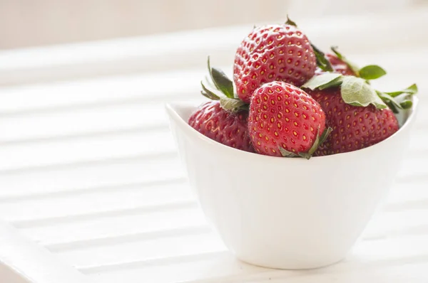 Fresh ripe strawberries on a vintage wooden background — Stock Photo, Image